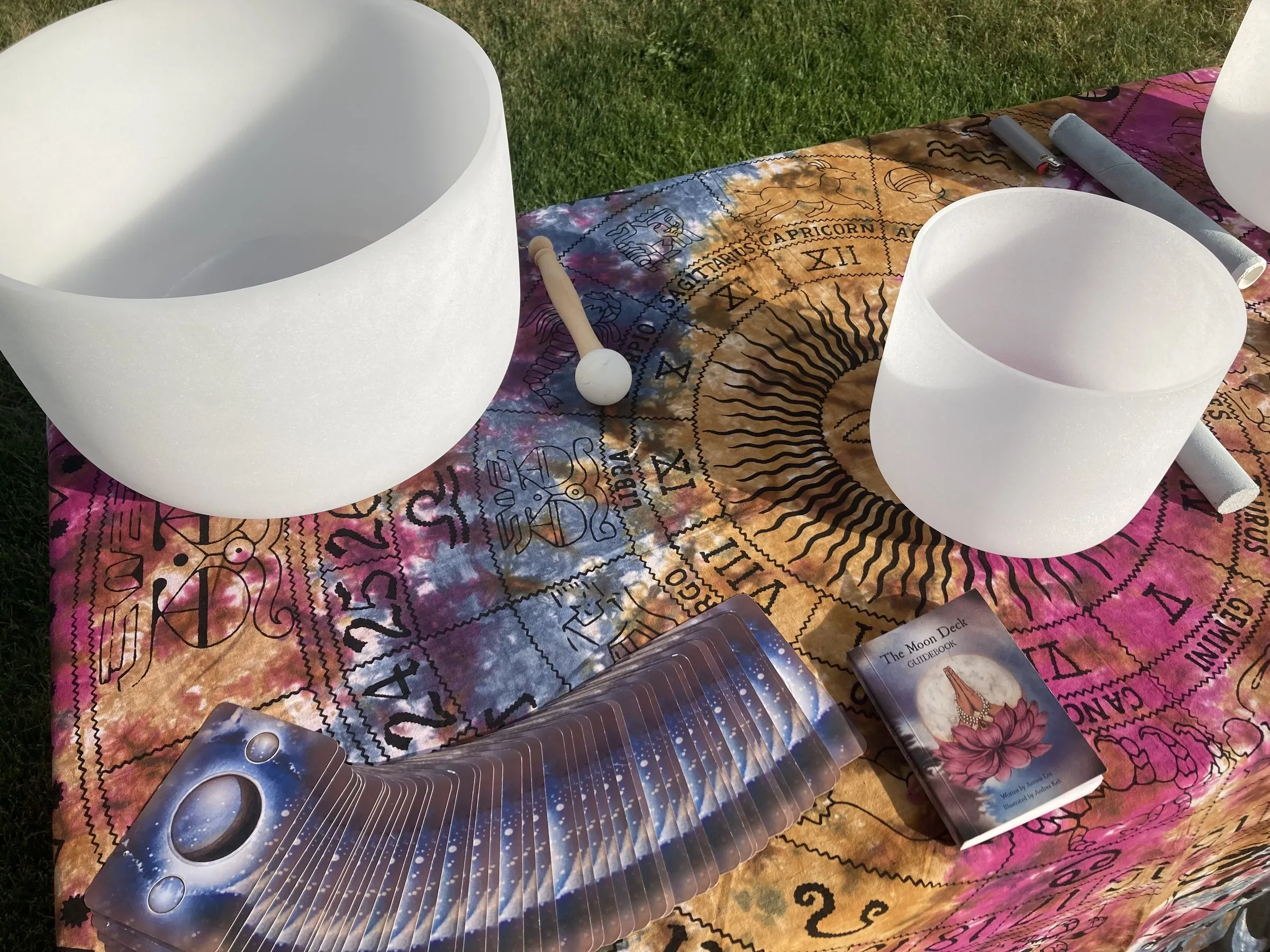 Crystal singing bowls arranged on a celestial cloth for a private event